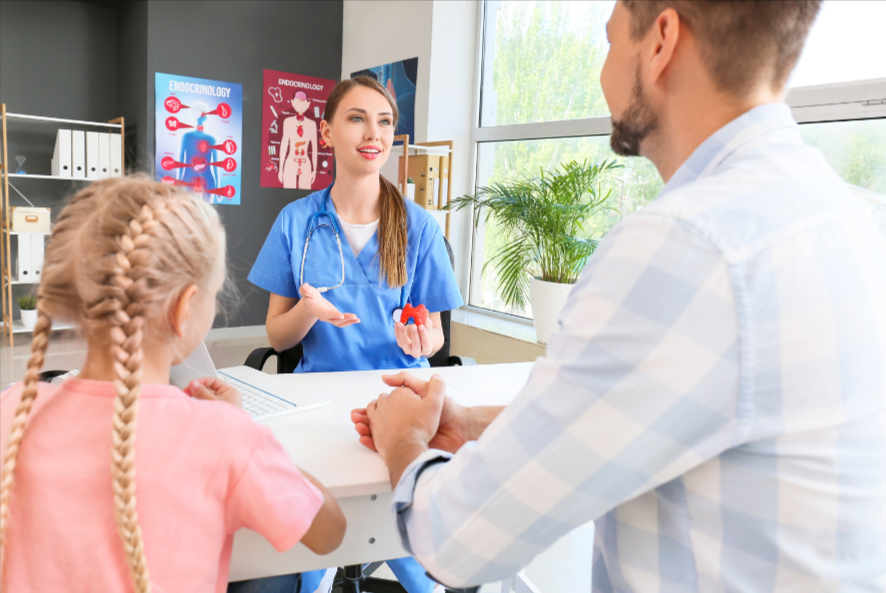 A medical professional discussing endocrinology issues with a father and young daughter.